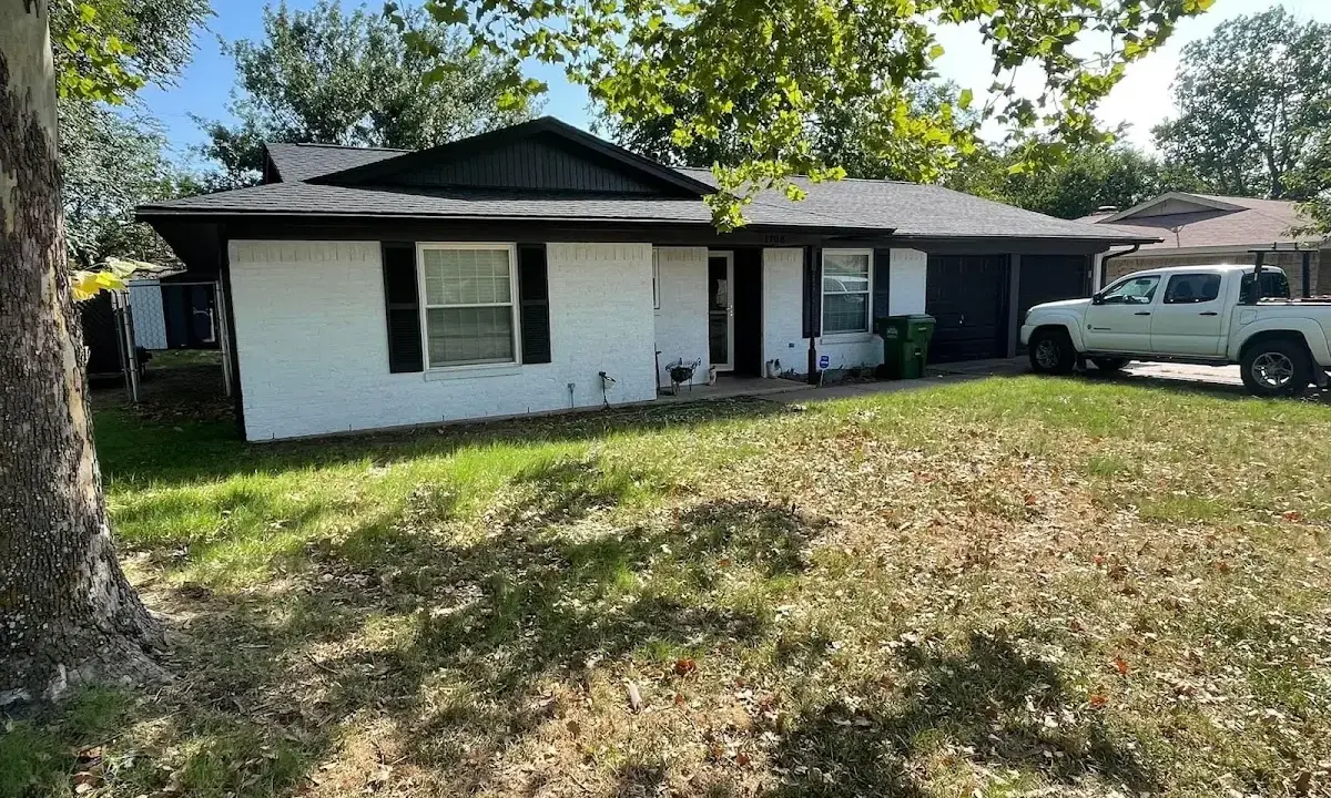 Professional roofing crew working on a residential roof in Fort Stockton